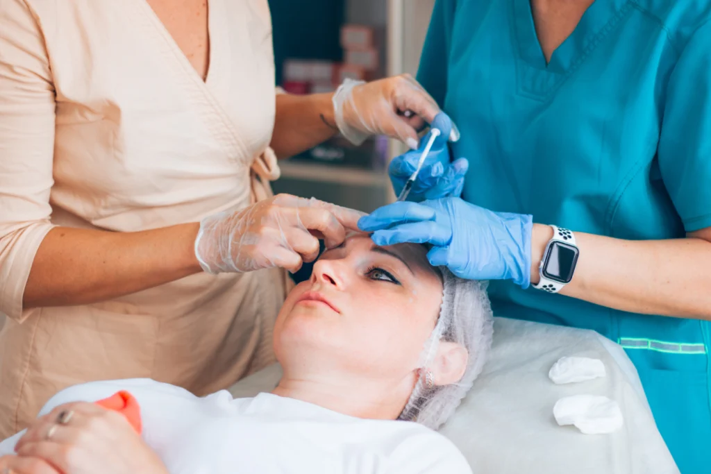 Medical professionals performing a Botox session on a patient to reduce fine lines and wrinkles.