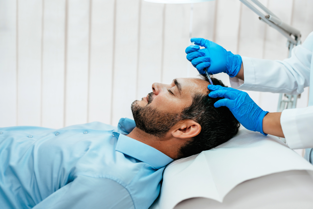 Male patient receiving a prp hair regrowth injection at a clinic.