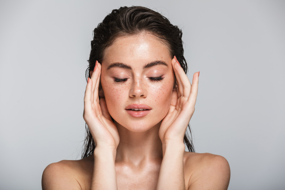 Woman with glowing skin after microneedling.